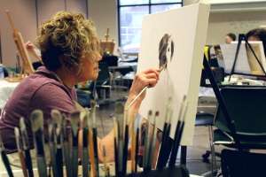woman painting in de pere community center
